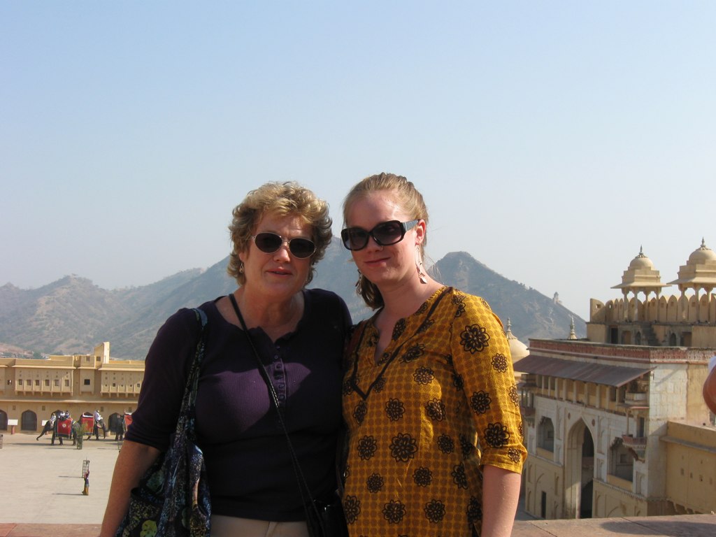 Two women in the courtyard of a fort in India